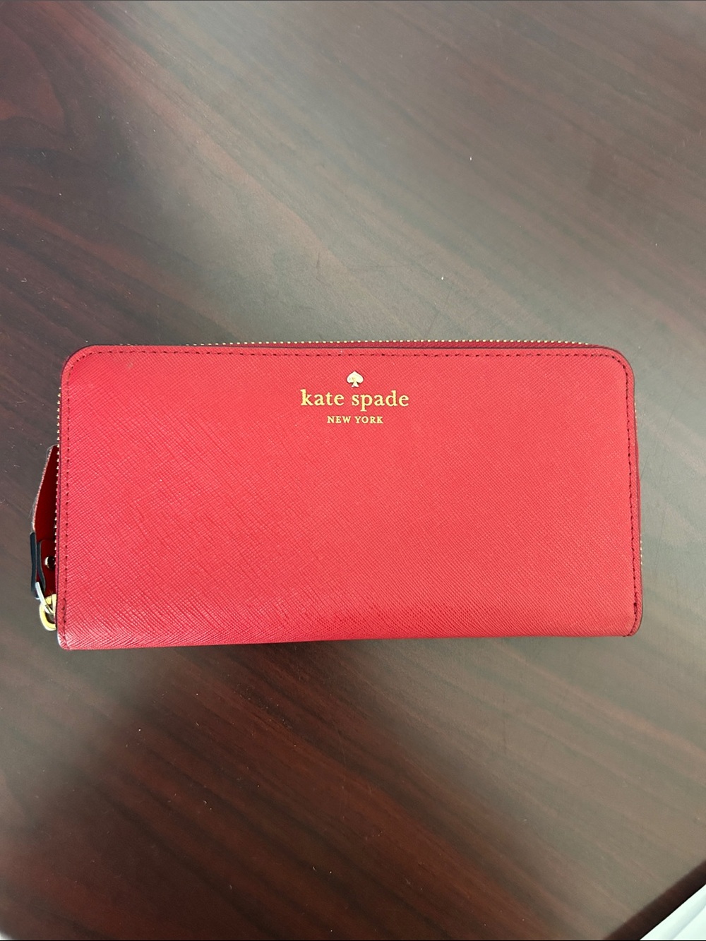 kate spade red zip-around saffiano wallet with gold logo